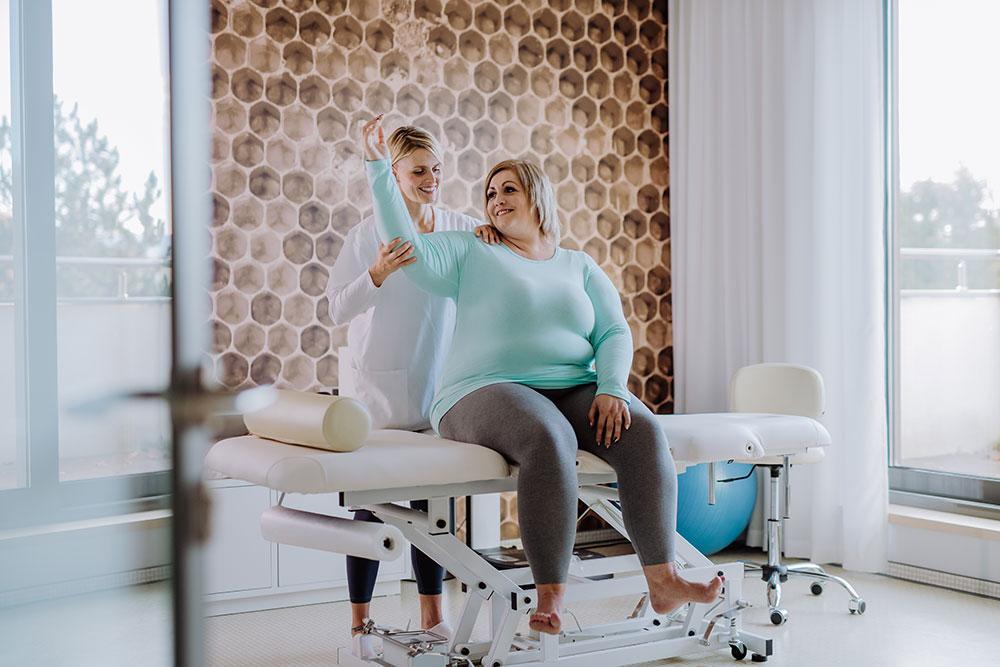 woman exercising arm post surgery