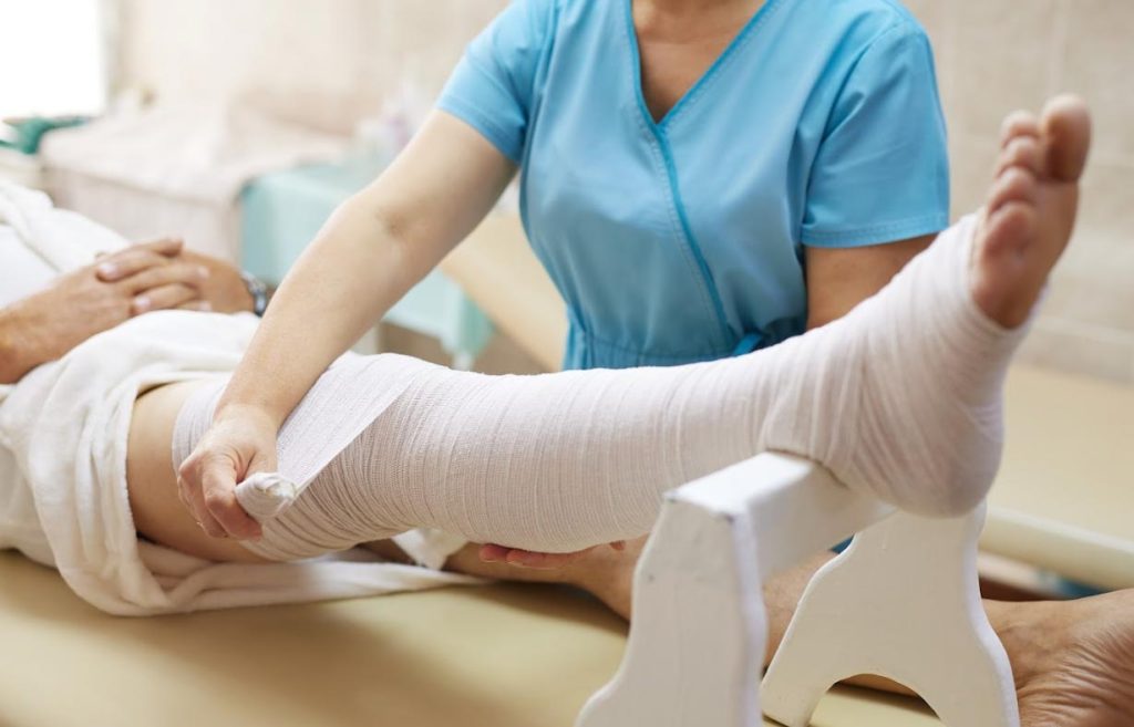 Wrapping-of-patients-leg-Functional-Transformation-Clinic