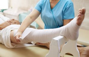 Wrapping-of-patients-leg-Functional-Transformation-Clinic